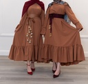 A wide brick-colored dress